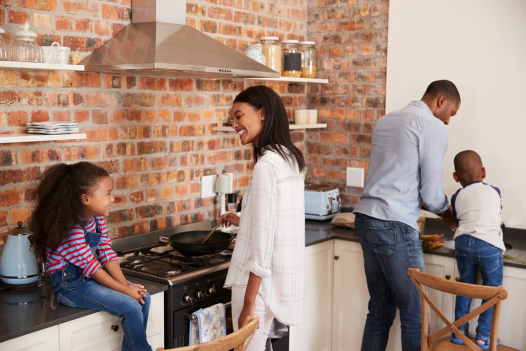 Happy family preparing a meal in the kitchen together